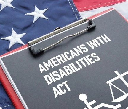 The images shows a note pad with Americans With Disability Act written on it.